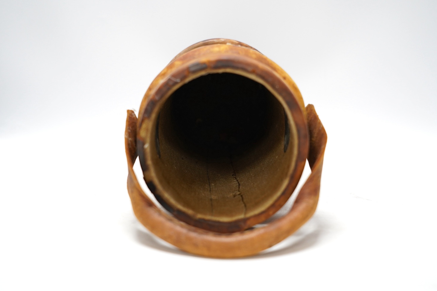 A leather powder flask, with painted Royal crest, 33cm high. Condition - poor to fair, some staining to the leather and wear at the edges